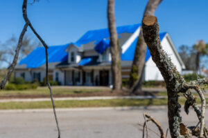 Securing your propery after a disaster with roof tarp and board up