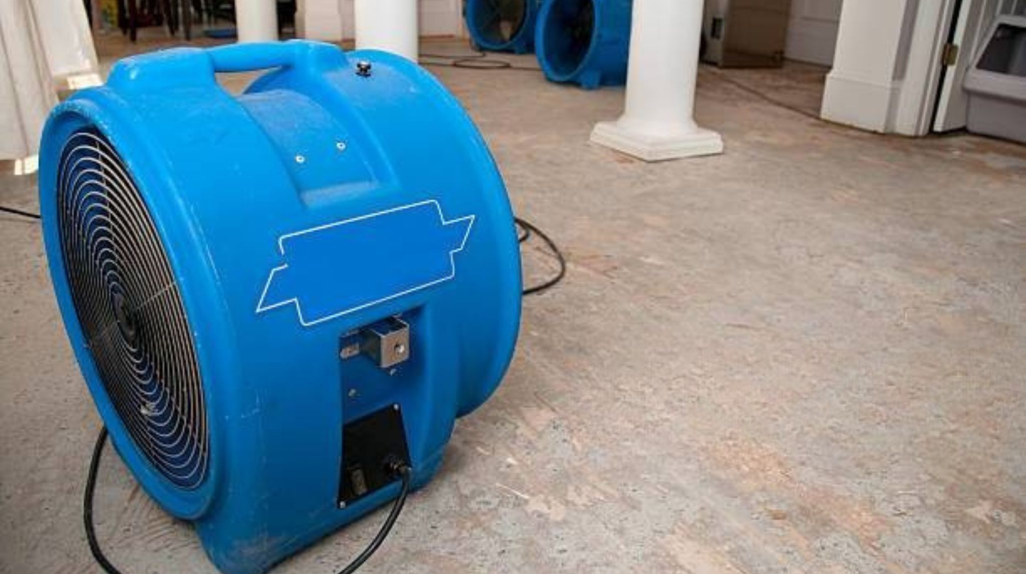 Air moving drying a home after water leaked into the basement.